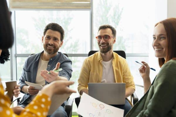 Why Joining a Networking Group is Essential 2 Sales managers analyze sales growth charts, working on developing business strategies in the office